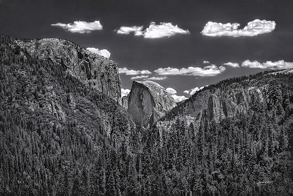 Three clouds and Half a Dome